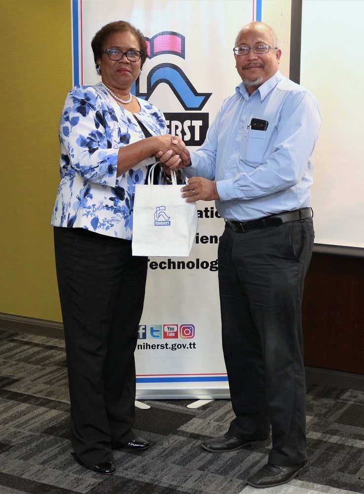 NIHERST President Marleen Lord-Lewis (left) presents a door prize to Intellectual Property Office(IPO), Manager, Mr Richard Aching at the NIHERST ‘Afternoon Forum’ held at the Education Towers on Friday 24th January, 2020.